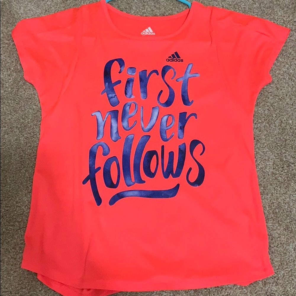 pink/orange and blue adidas shirt.
